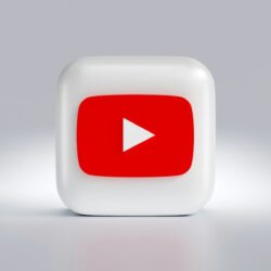 a white square button with a red arrow on it