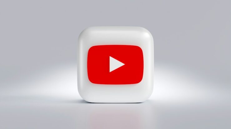 a white square button with a red arrow on it