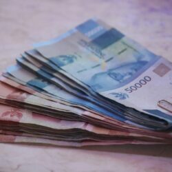 200 banknote on white textile