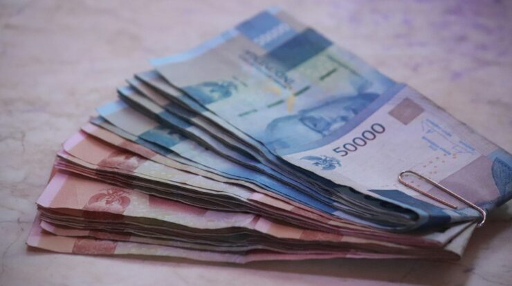 200 banknote on white textile