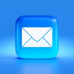 a blue button with a white envelope on it
