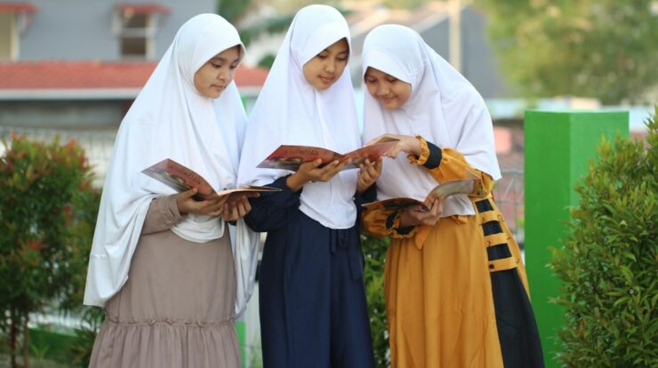 A group of women standing next to each other
