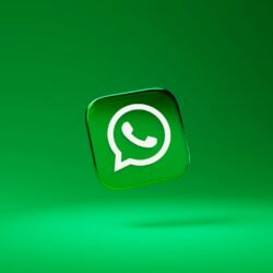 A glossy green square icon with a white telephone handset inside a speech bubble