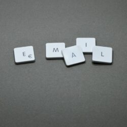 The word "email" is spelled out with letter tiles