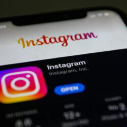 the instagram logo is displayed on an iphone