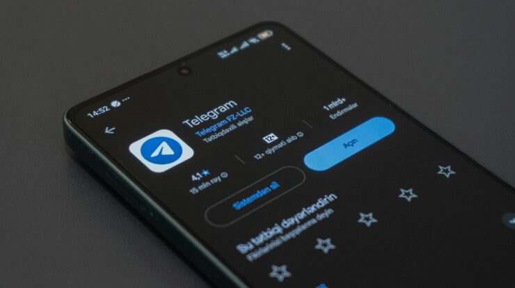 A phone screen displays the telegram app