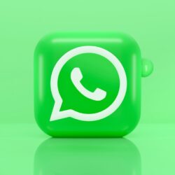 A green 3D icon of a telephone handset inside a speech bubble