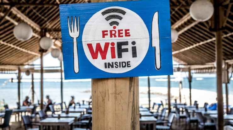 Free WiFi signage on wooden post