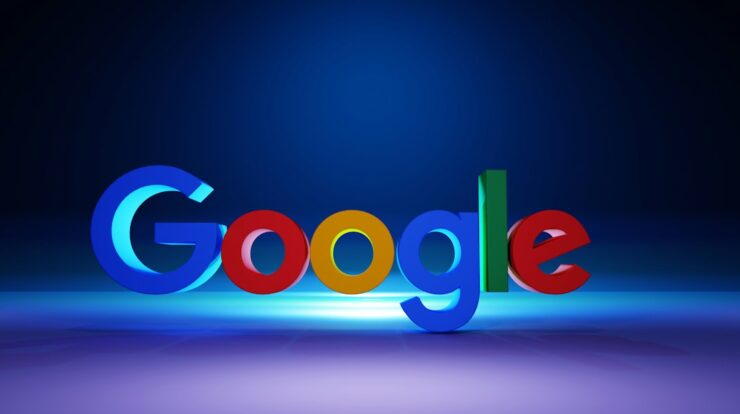 The Google logo in colorful 3D letters on a dark blue surface