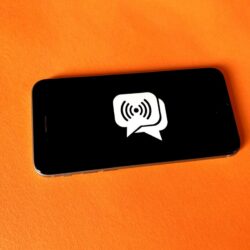 black and white smartphone on brown textile