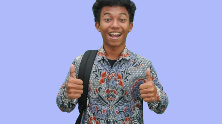 A man with a backpack giving a thumbs up