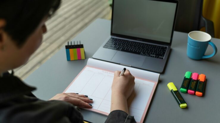a man writing on a piece of paper