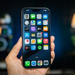 A person holding a cell phone in their hand