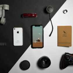 a collection of electronics and gadgets laid out on a table