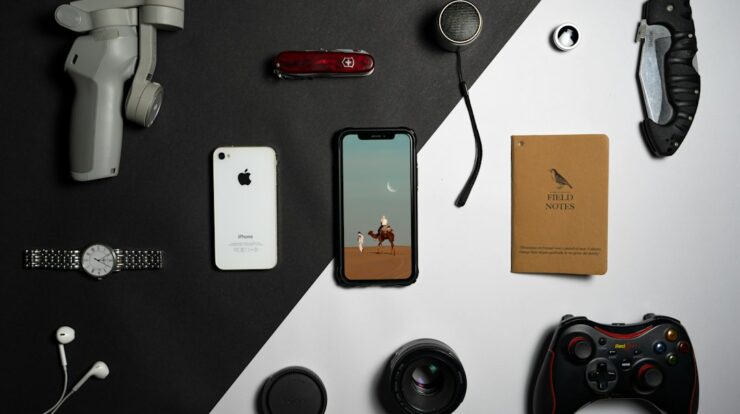 a collection of electronics and gadgets laid out on a table