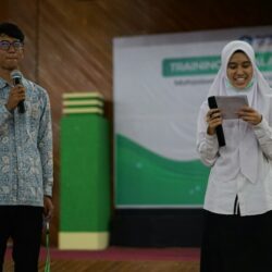 a man holding a microphone and a woman holding a microphone
