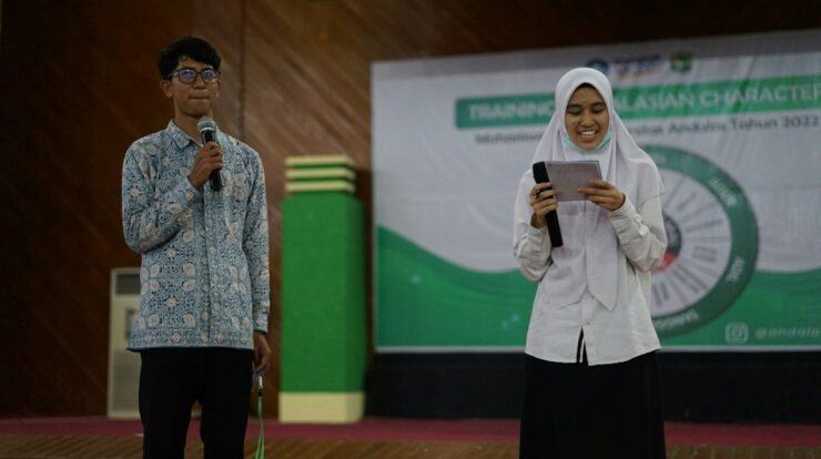 a man holding a microphone and a woman holding a microphone