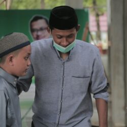 a man and a boy wearing a face mask