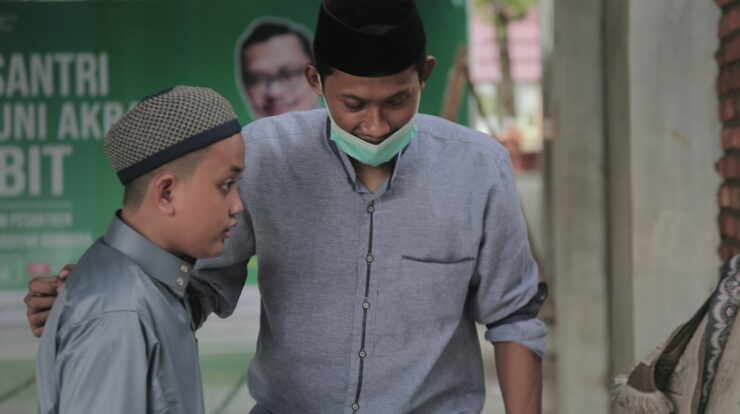 a man and a boy wearing a face mask